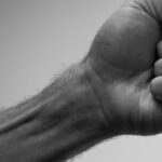 Stop Fist Clenching at Night: Causes & Solutions